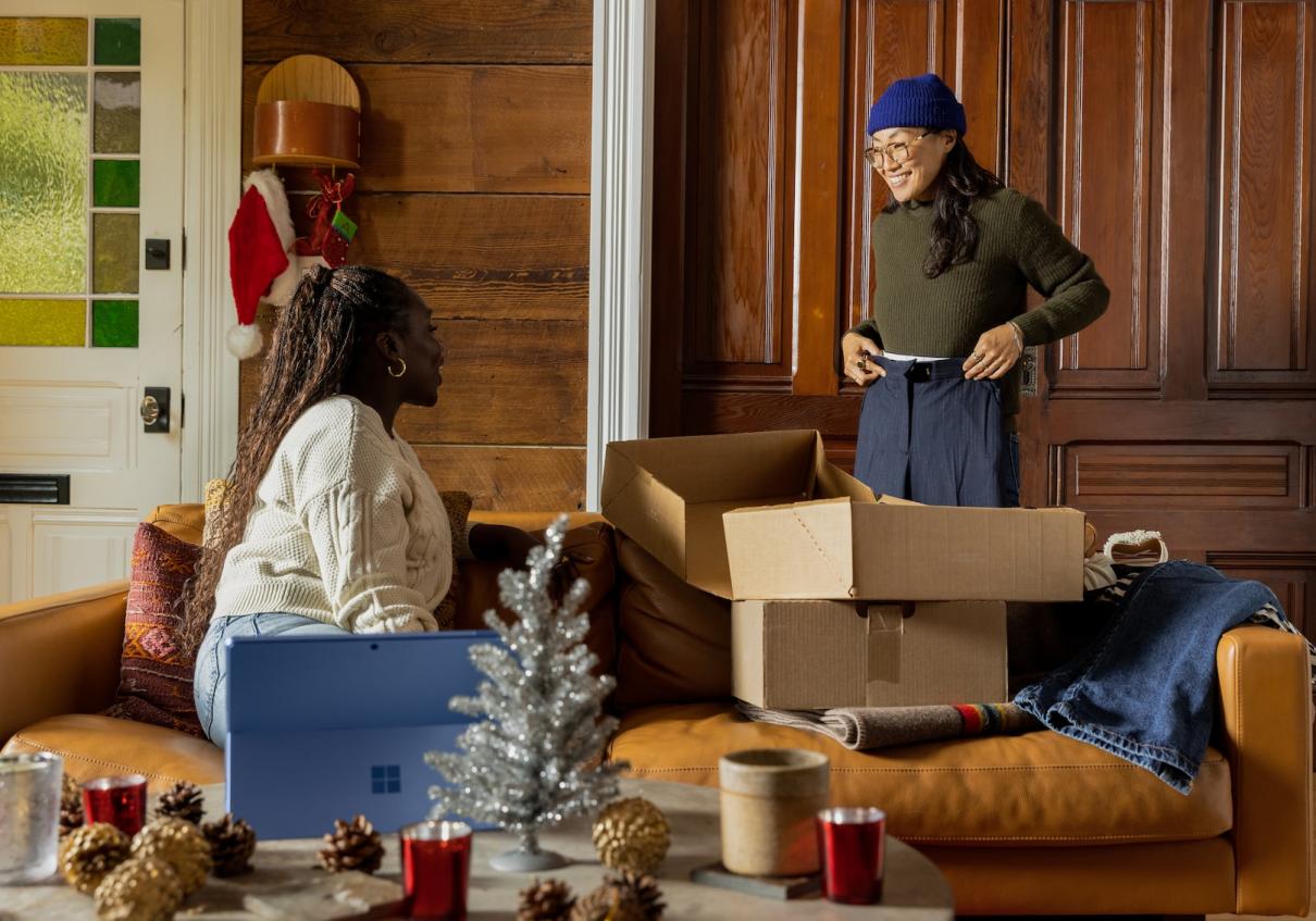 two women unpacking in a new house