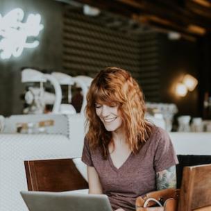 smiling woman working in a fancy cafe.